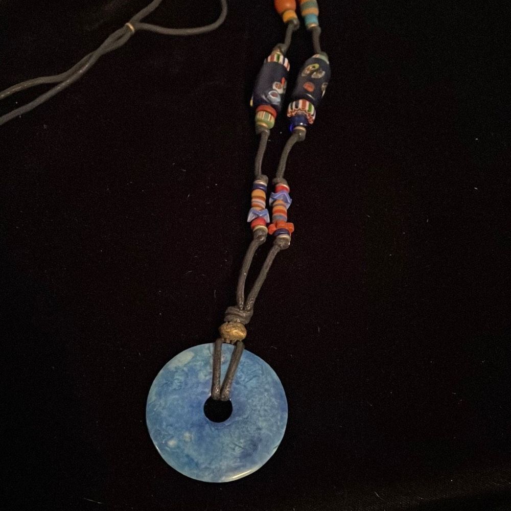 Craft necklace with blue stone ring and crafted beads